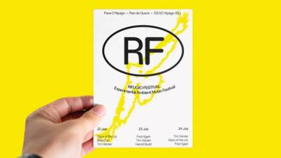 Rifugio Festival identity design – RF logo flyer with yellow paint texture, held in hand against yellow background