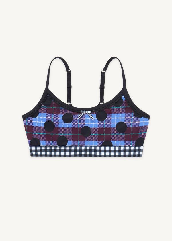 Flat front view of plaid polka dot print sports bra with contrasting black and white gingham elastic band, picot elastic trimming and gingham ribbon at front. 