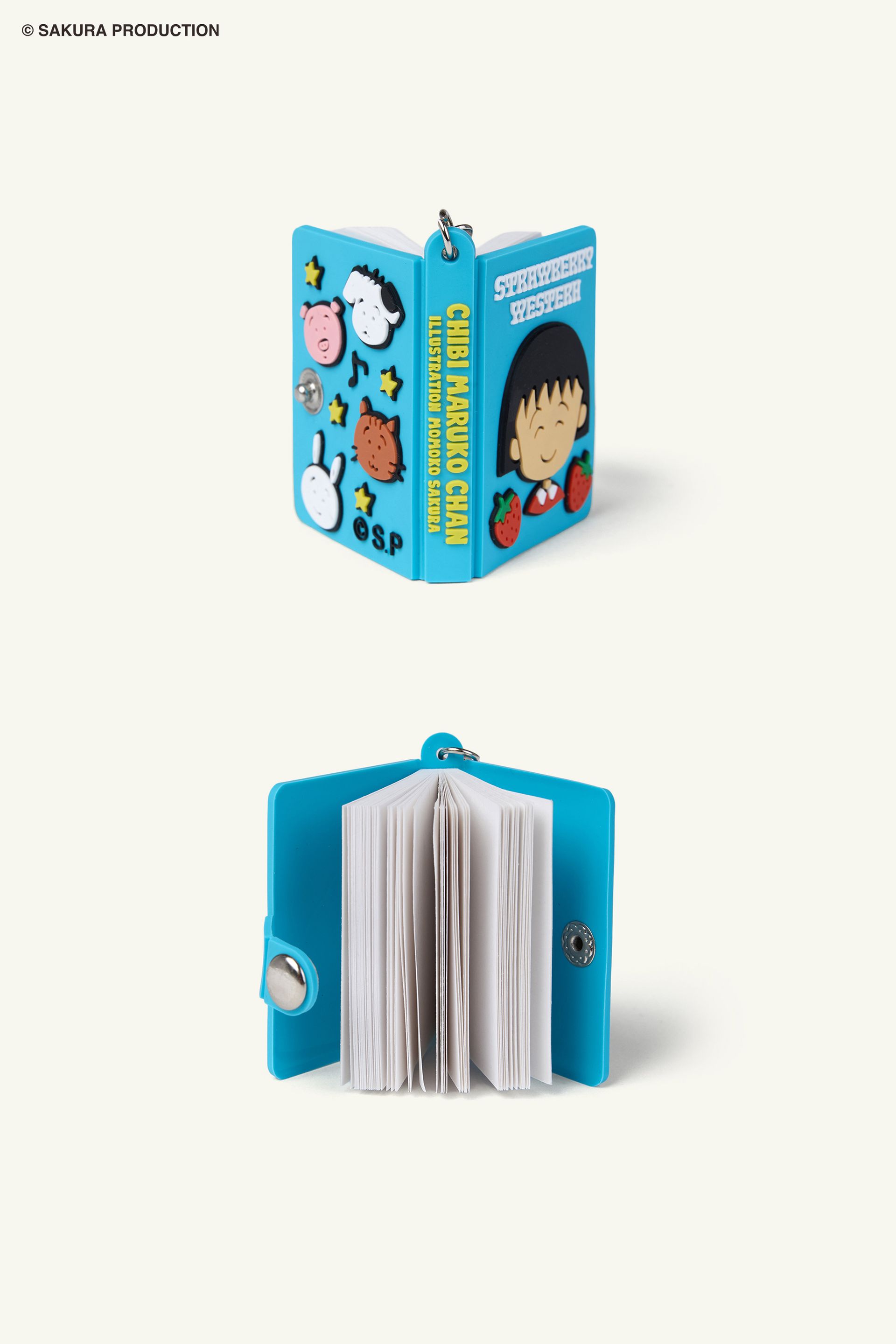 Flat image of outside and inside of Chibi Maruko Chan Secret Notebook. Front features Chibi Maruko-chan smiling and two strawberries. Top reads "Strawberry Western" in white lettering. Back features animal friends, stars, and music notes. Spine reads Chibi Maruko Chan in yellow lettering.