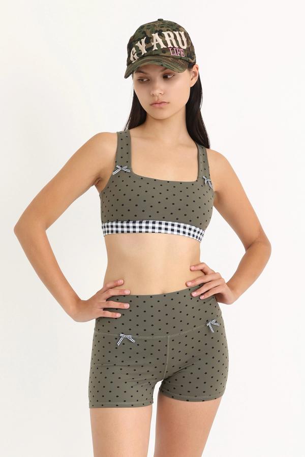 Soft and supportive high-waisted yoga shorts with a fixed 3" inseam in an Olive Polka Dot print with gingham bows at the front.