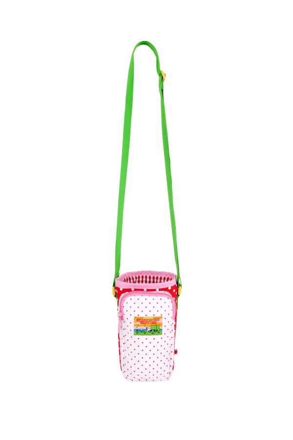 Water bottle bag in red and white polka dots with a zippered phone pocket in white with pink polka dots and a green strap.