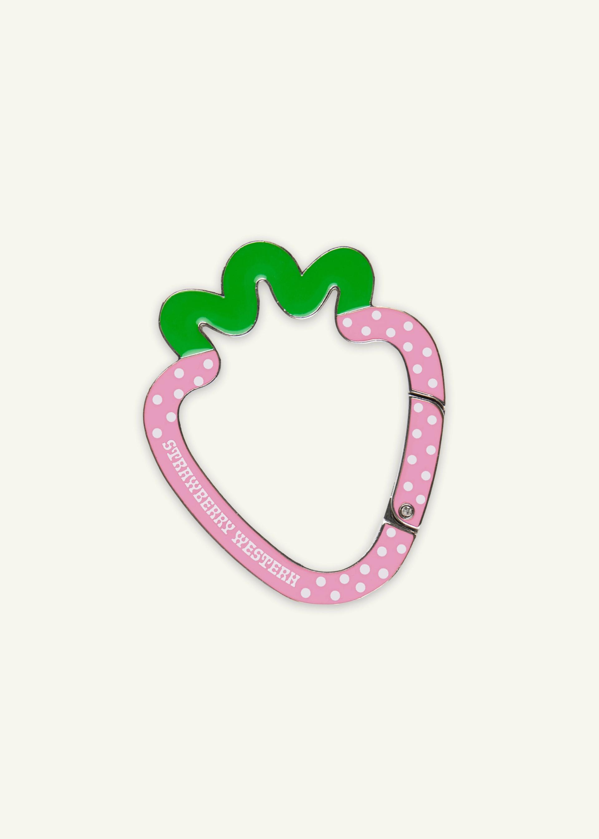 Strawberry shaped metal carabiner in pink and green enamel with white polka dots and Strawberry Western logo.