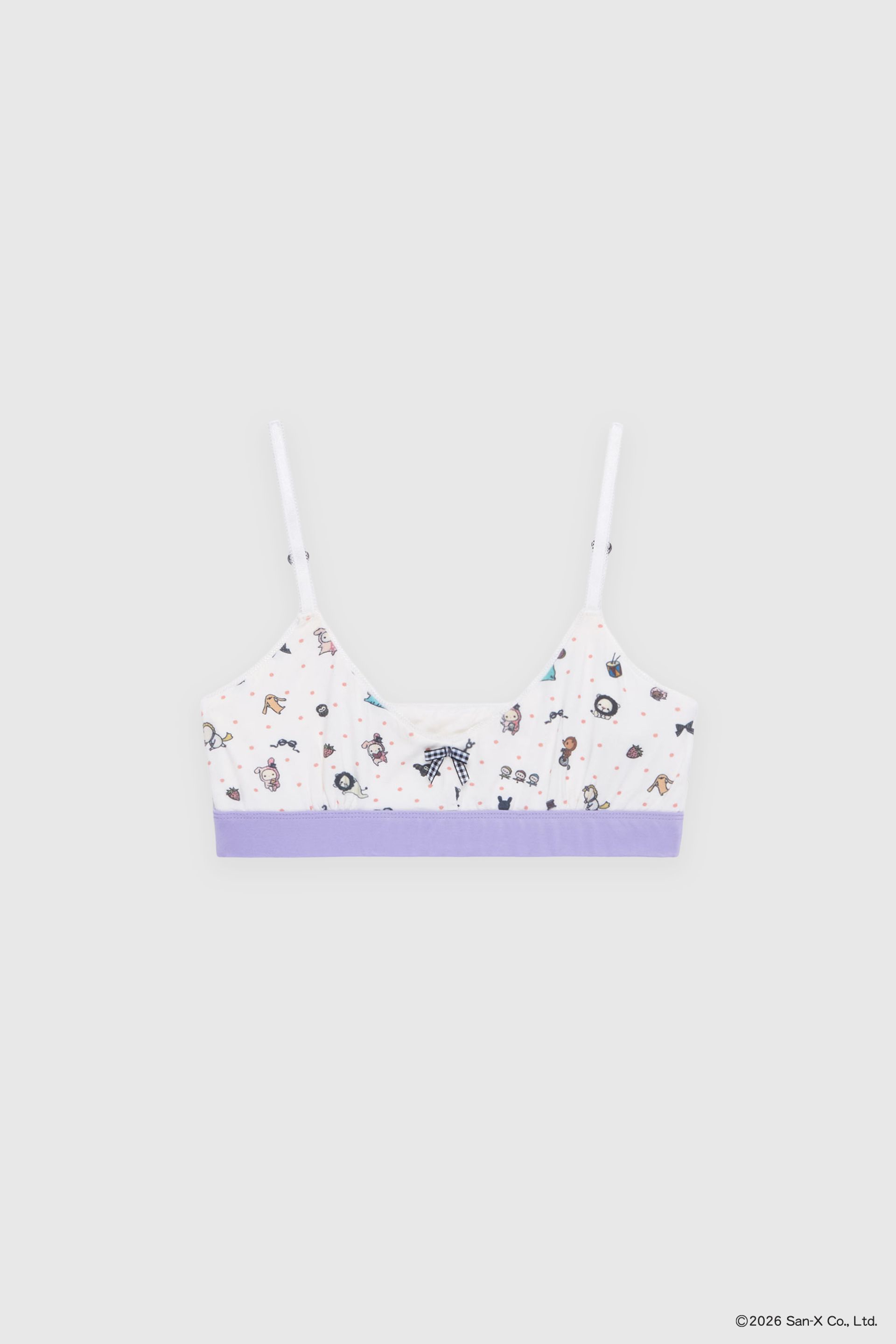 Flat image of the most comfortable stretch bamboo bralette for lounging or wearing out. A truly barely-there feel. Beloved characters and trinkets of Sentimental Circus are scattered with polka dots into a sweet ditsy print. Our picot edge elastic straps are adjustable using the little heart-shaped sliders. Our signature gingham bow at the front. A contrast encased elastic band made from the same stretch bamboo keeps the bra in place while still feeling soft and seamless.