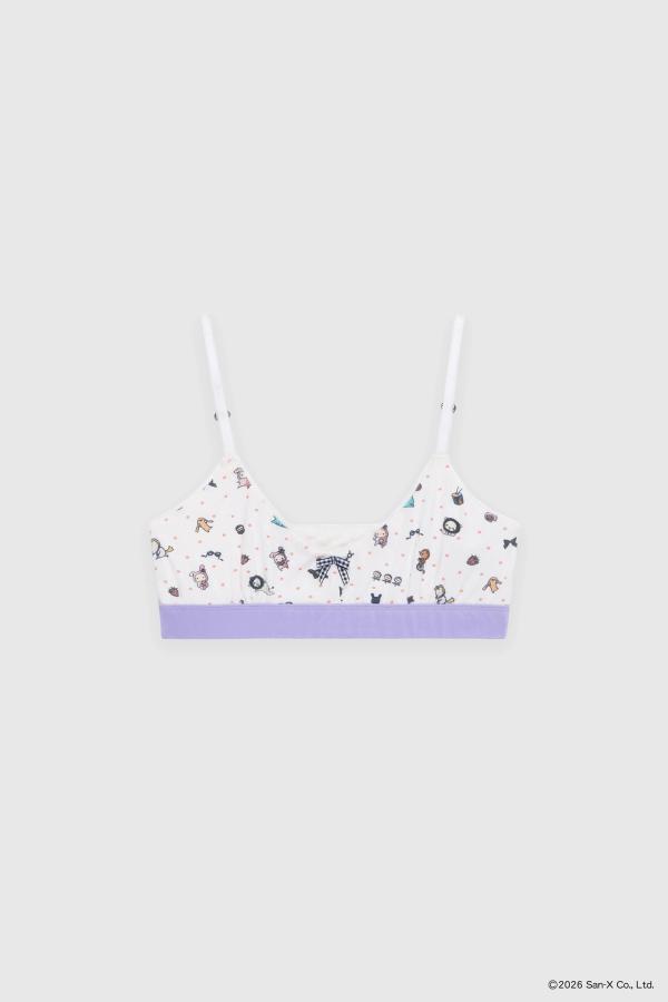 Flat image of the most comfortable stretch bamboo bralette for lounging or wearing out. A truly barely-there feel. Beloved characters and trinkets of Sentimental Circus are scattered with polka dots into a sweet ditsy print. Our picot edge elastic straps are adjustable using the little heart-shaped sliders. Our signature gingham bow at the front. A contrast encased elastic band made from the same stretch bamboo keeps the bra in place while still feeling soft and seamless.