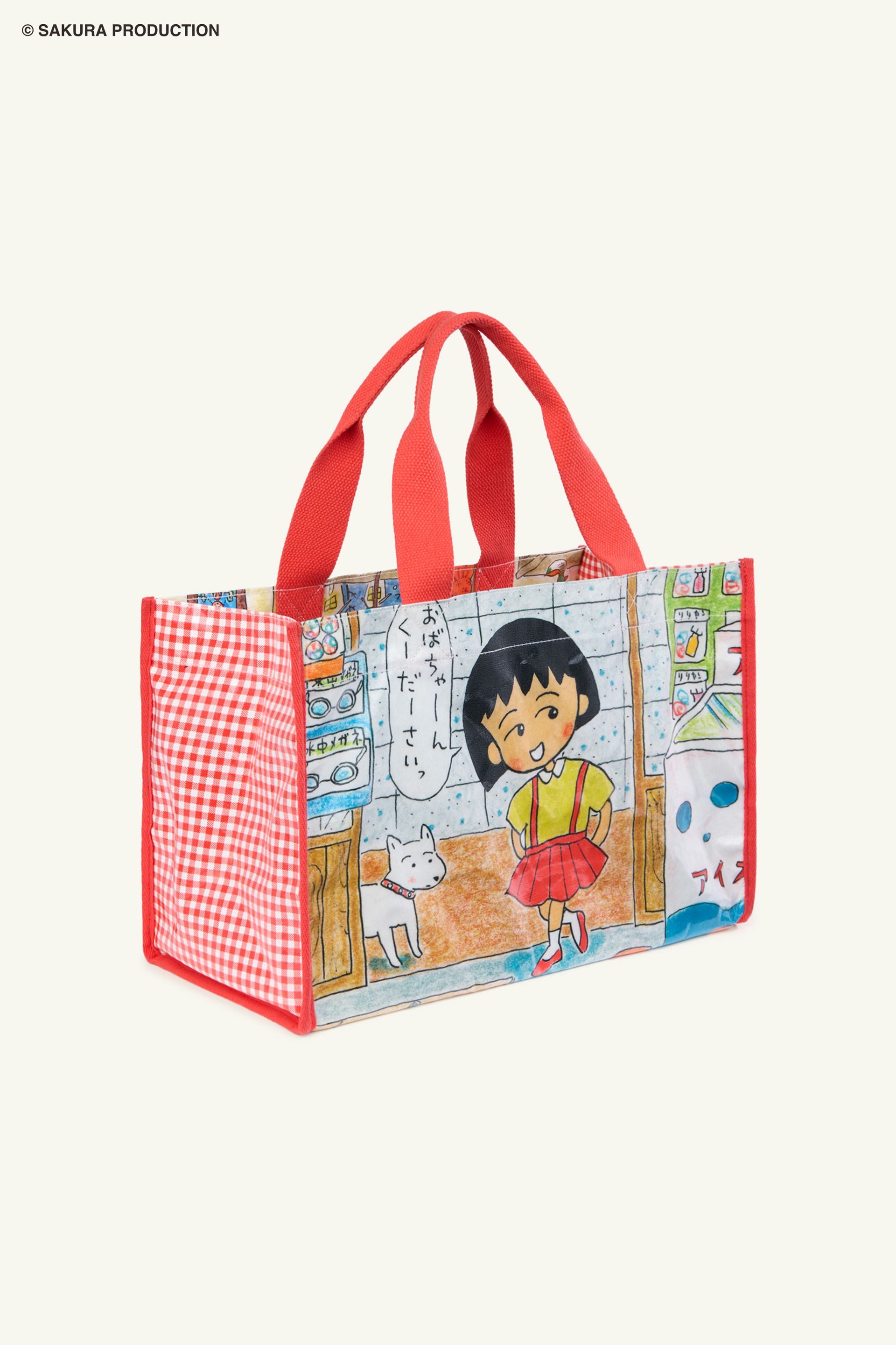 Flat image of Carryall Bag. Plastic tote with image of manga drawing Chibi Maruko Chan and her dog walking into a store. She says "Grandma Please" in Japanese. Side panels red gingham print. Handles and trim are red.