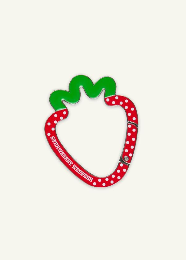 Strawberry shaped metal carabiner in red and green enamel with white polka dots and Strawberry Western logo.