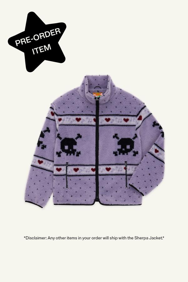 A Dusty Purple sherpa jacket featuring skull and crossbones patterns, dark red hearts, and light purple musical note designs across the chest and sleeves. Star in top left corner reads "Pre-Order Item."