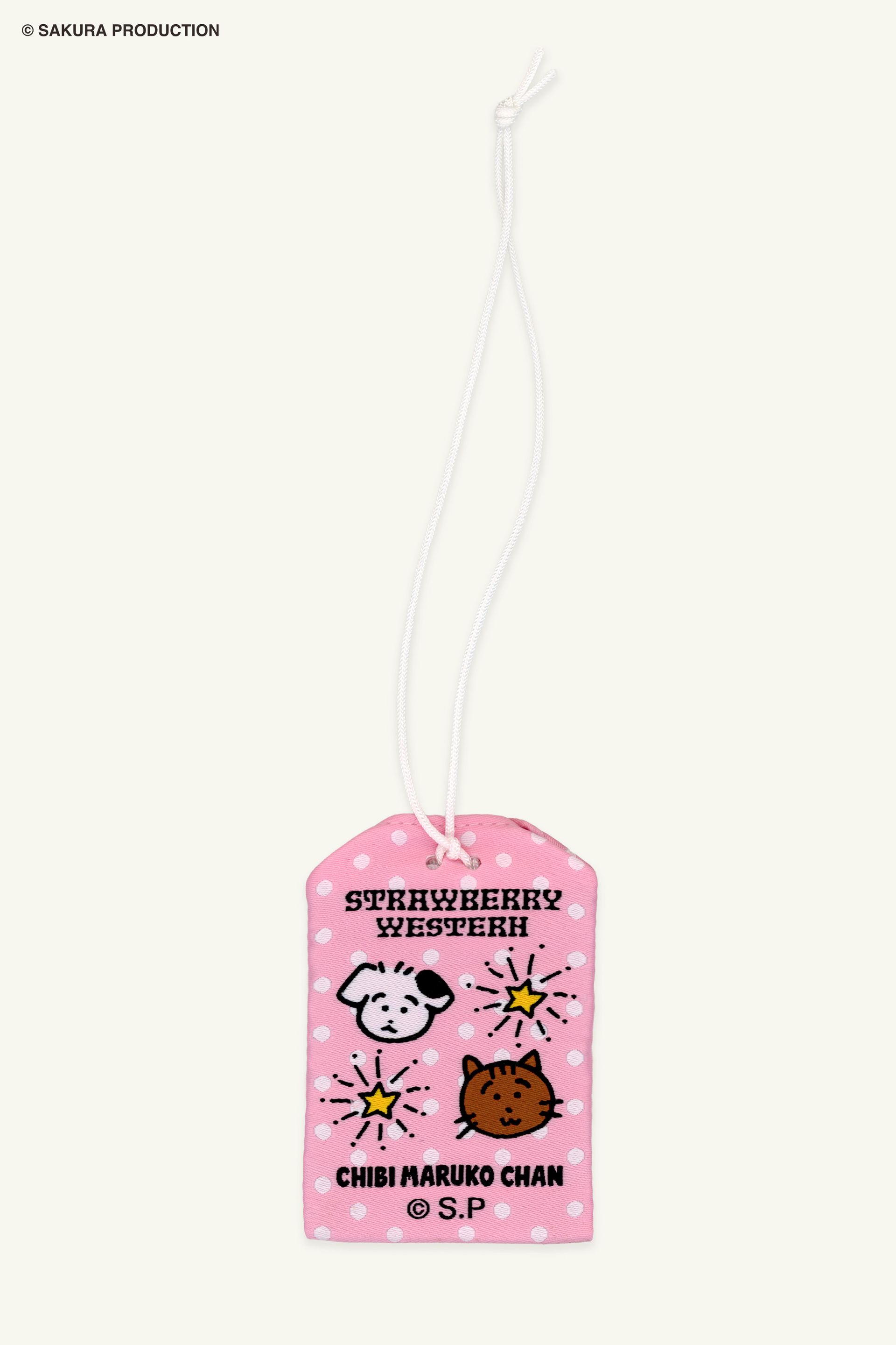 Flat image of back Chibi Maruko Chan Omamori Keychain. Pink omamori charm with white polka dots, animal friends, and stars. Reads Strawberry Western and Chibi Maruko Chan.