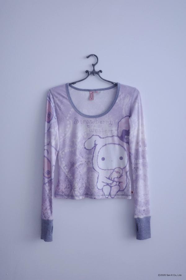 Flat image of a hanger holding An ethereal engineered print long-sleeve top featuring Shappo the Ringmaster. Cut from a lightweight, 110gsm 100% Cotton with chunky, heathered dusty purple ribbing at the neck and sleeve cuffs. The sleeves are finished with taller cuffs and built-in thumb holes, providing extra coverage and keeping your hands warm during the colder months.