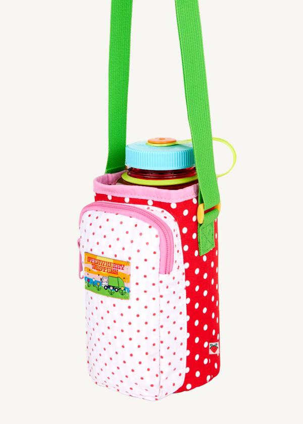 3/4 view of water bottle bag in red and white polka dots with a zippered phone pocket in white with red polka dots.