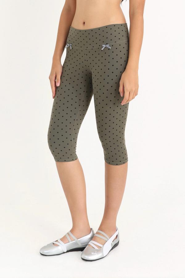 Super flattering, lower-rise capri leggings in an Olive Polka Dot print with gingham bows at the front.