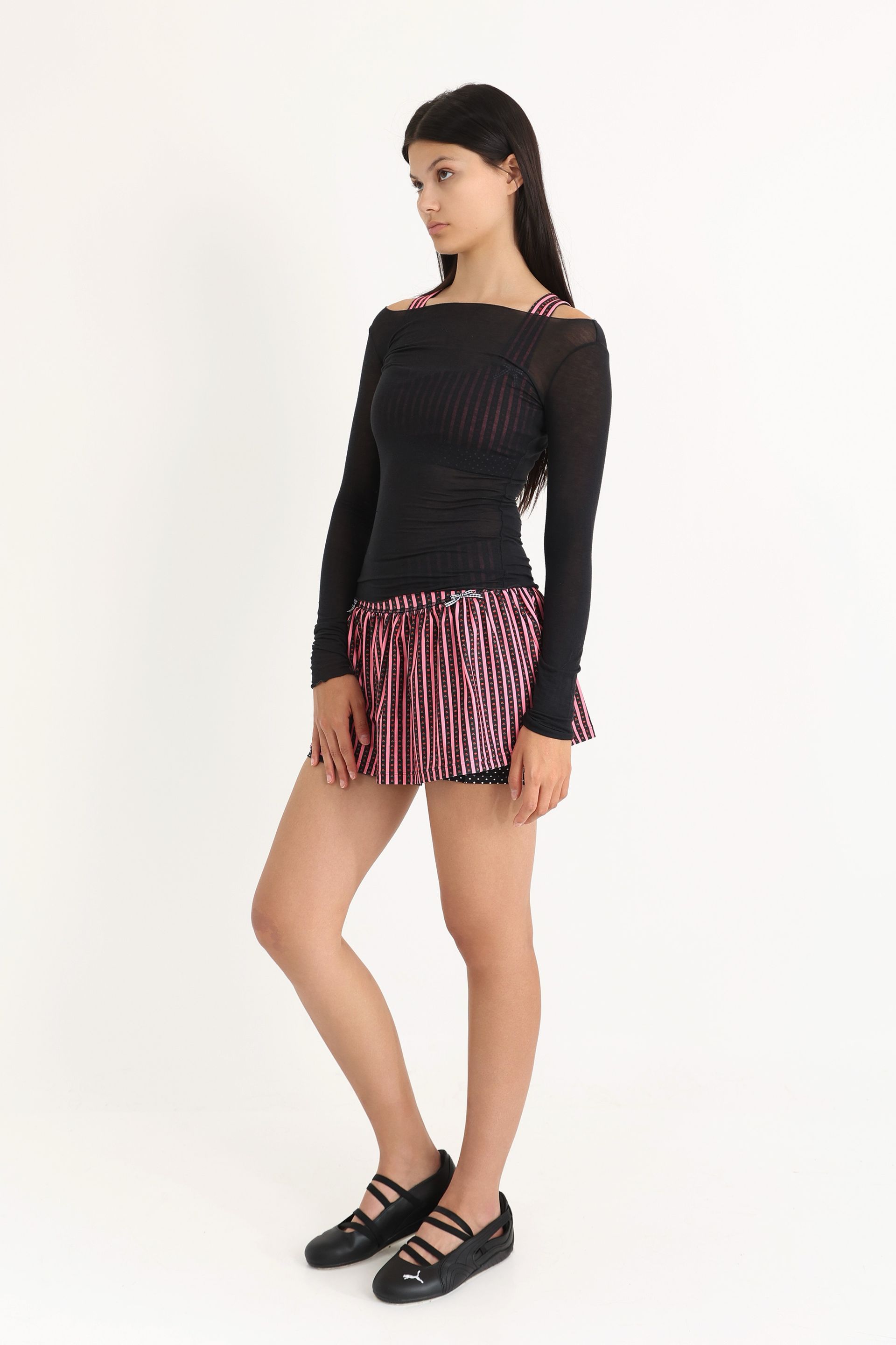 Gathered ruffle exercise skort in a hand-drawn, Pink/Black floral border stripe print with contrast black and white polka dot print and gingham bow details.