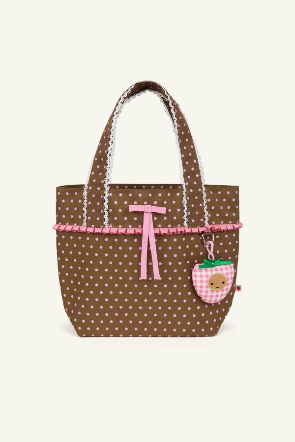 Front view of a brown color polka dot ruffle trim mini shoulder bag with crochet scallop edging, a black and white gingham lining and a drawstring cinch closure.