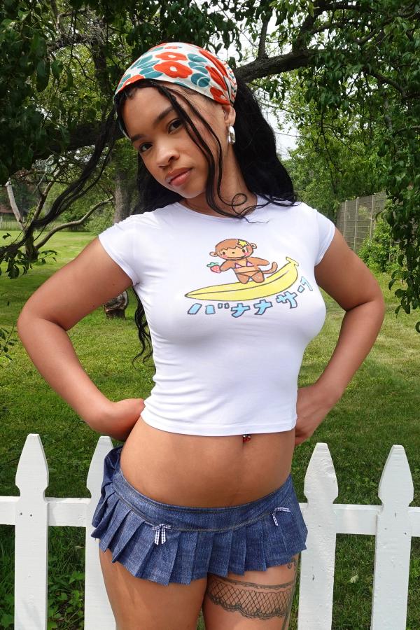 White slim fit baby tee with a hand-drawn surfing monkey graphic that says 'Banana Surf' in Japanese below it.