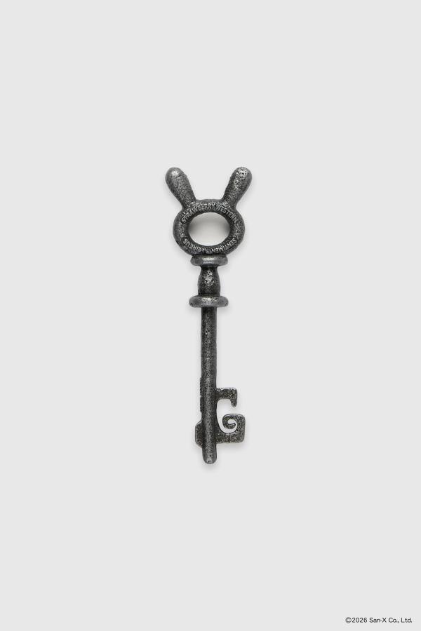 Close up flat image of a beautiful and heavy Sentimental Circus skeleton key. These bunny head keys were brought to life from 2D in a cast iron texture featuring the Sentimental Circus and Strawberry Western logos on both sides. 