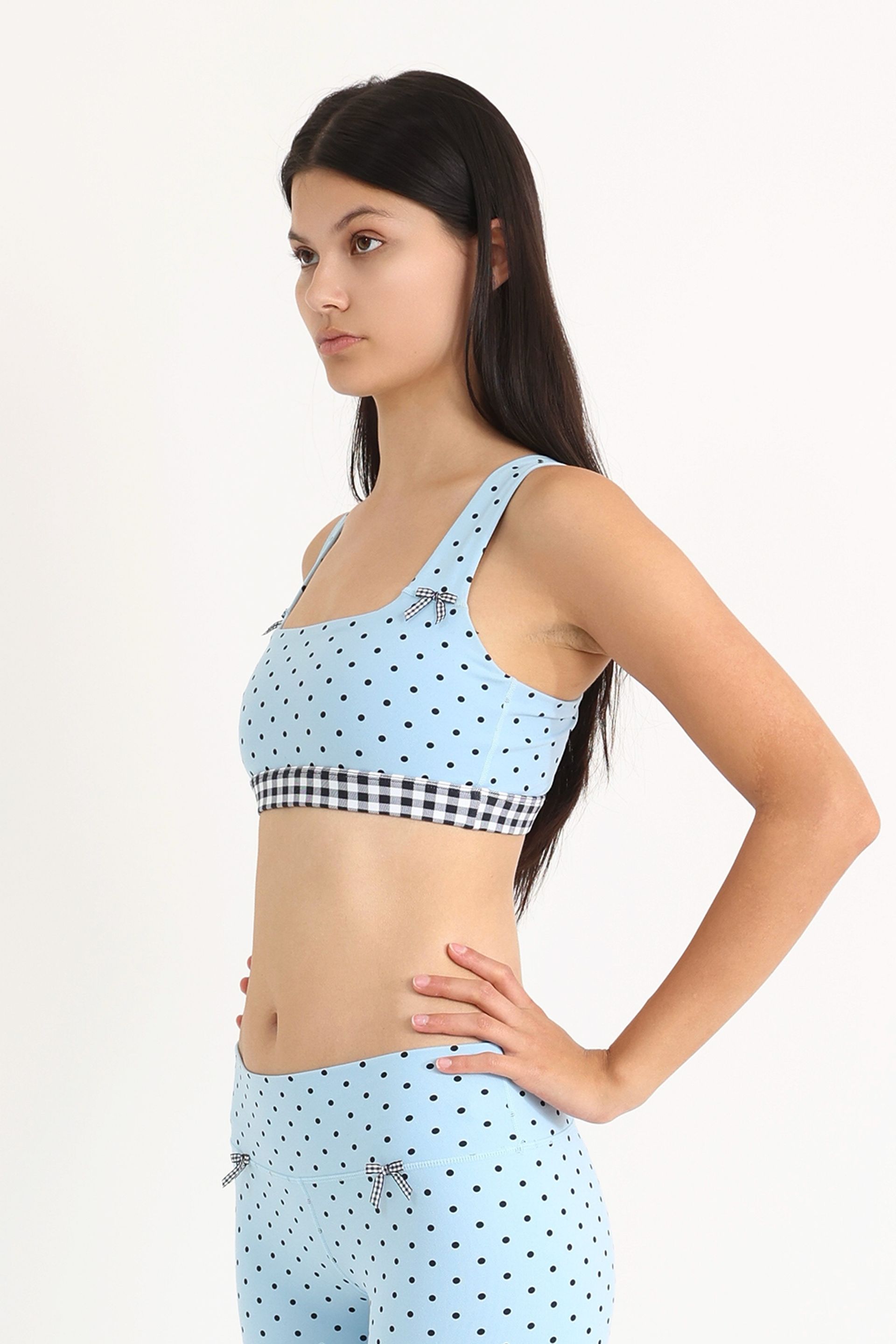 Medium-support Coco Sports Bra in a Blue Polka Dot print, gingham elastic band and ginghams bows at straps.