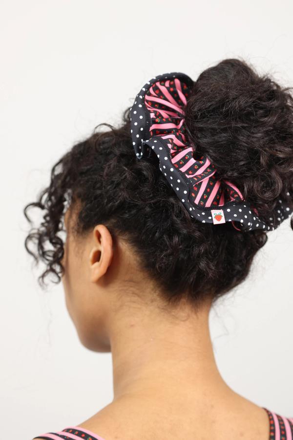 Super cute scrunchie in a hand-drawn, Pink/Black floral border stripe print with contrasting polka dot trim.