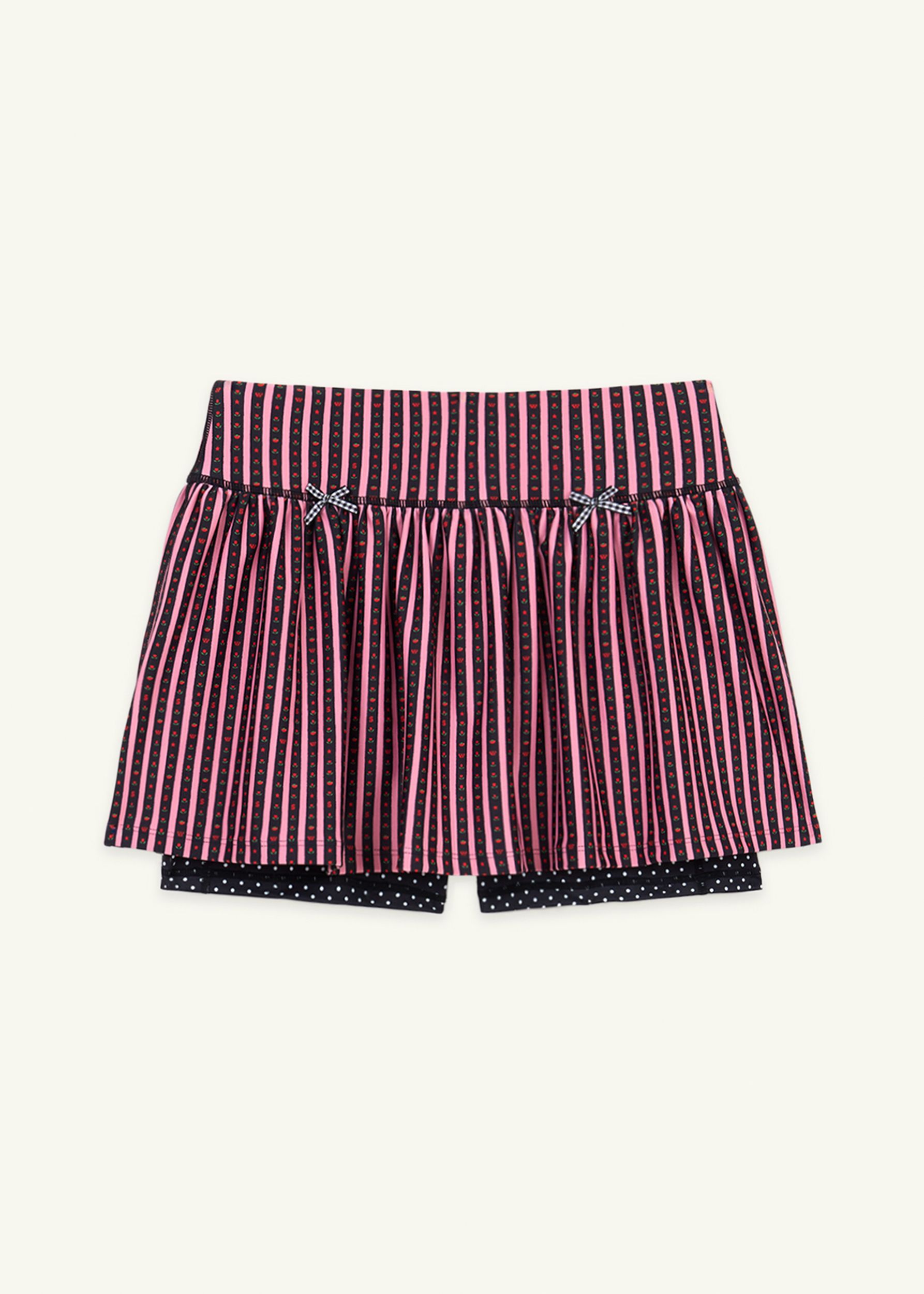 Gathered ruffle exercise skort in a hand-drawn, Pink/Black floral border stripe print with contrast black and white polka dot print and gingham bow details.