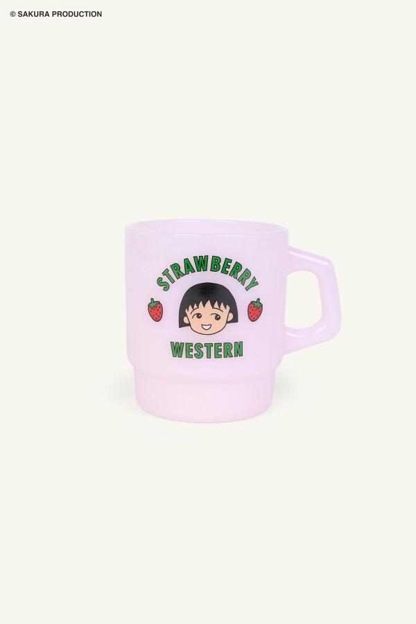 Flat image of Pink Chibi Maruko Chan Milky Mug. The front reads Strawberry Western in green lettering. In the middle is Chibi Maruko-chan's face surrounded by two strawberries.
