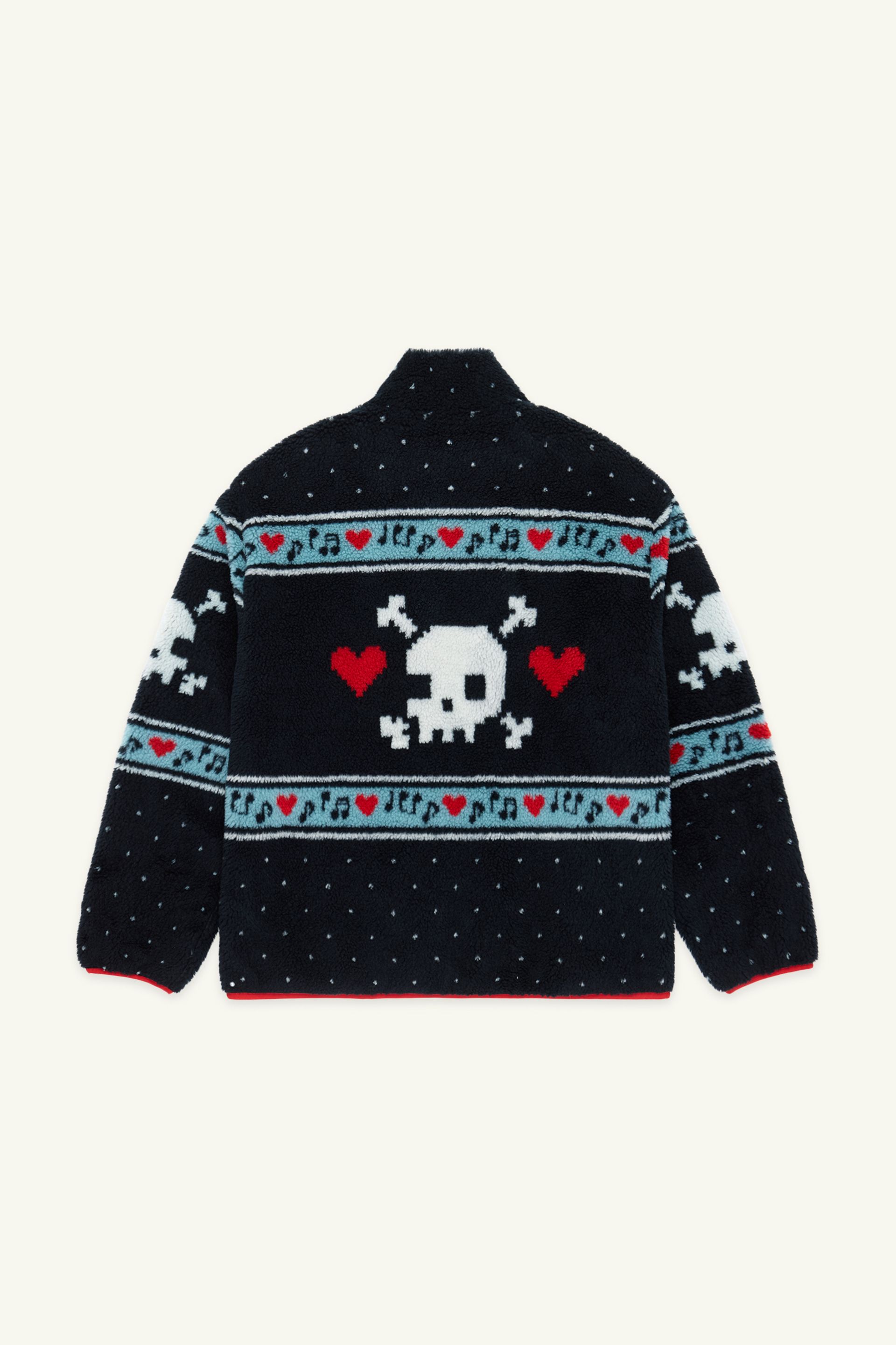 Back view of a black multi sherpa jacket featuring white skull and crossbones patterns, red hearts, and light blue musical note designs across the chest and sleeves