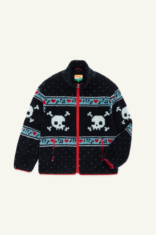 A black multi sherpa jacket featuring white skull and crossbones patterns, red hearts, and light blue musical note designs across the chest and sleeves