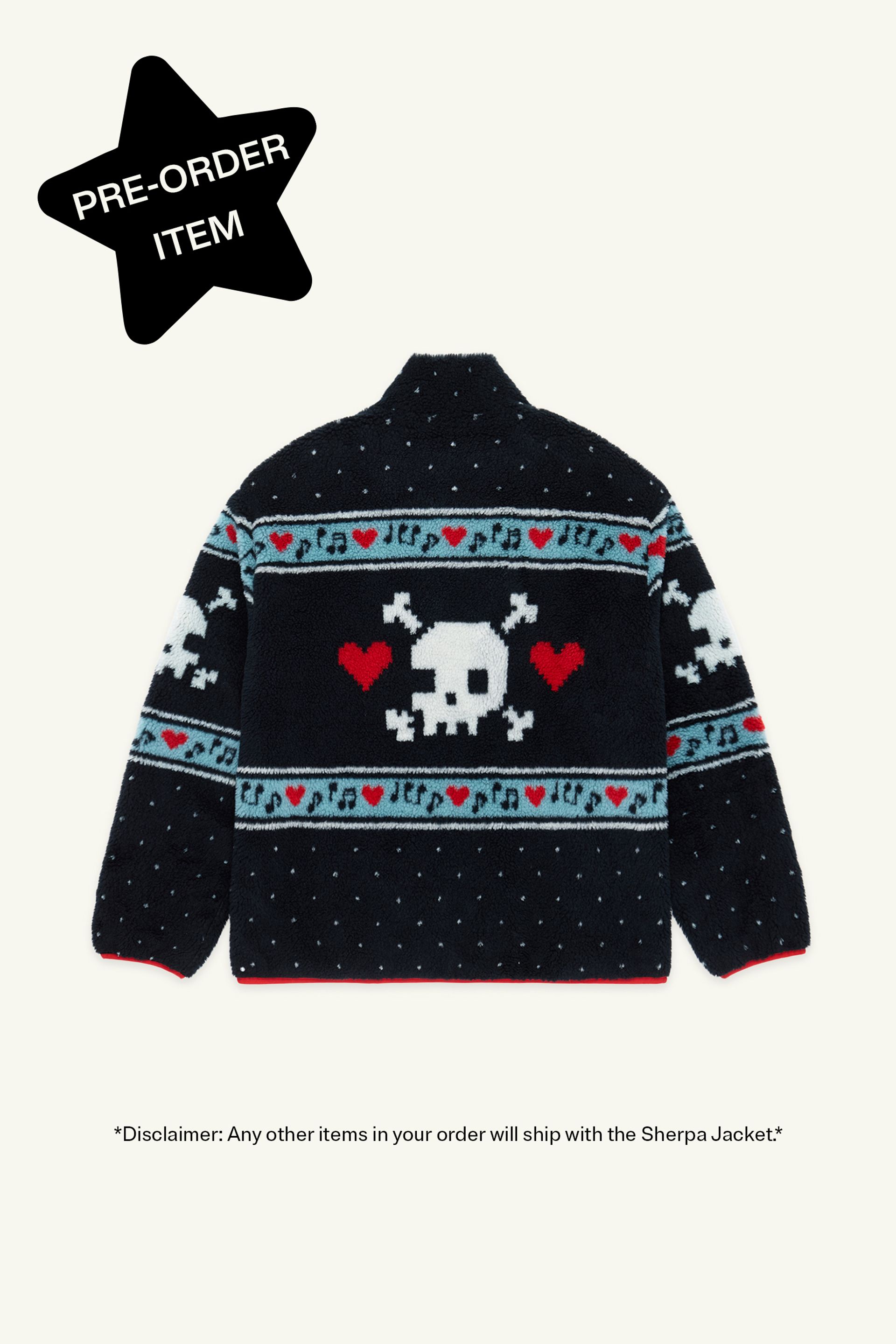 Back view of a Black Multi sherpa jacket featuring white skull and crossbones patterns, red hearts, and light blue musical note designs across the chest and sleeves. Black star in top left corner reads "Pre-order item" 