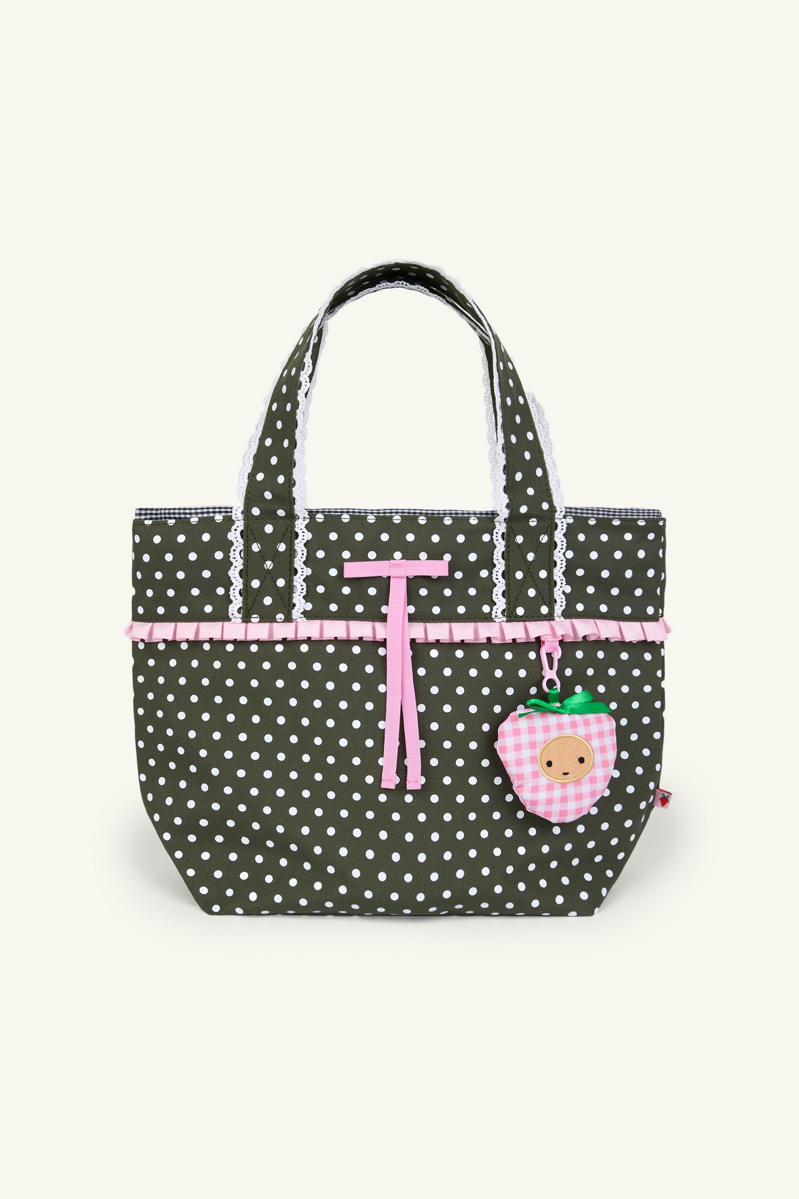 Front view of an olive color polka dot ruffle trim mini shoulder bag with crochet scallop edging, a black and white gingham lining and a drawstring cinch closure.