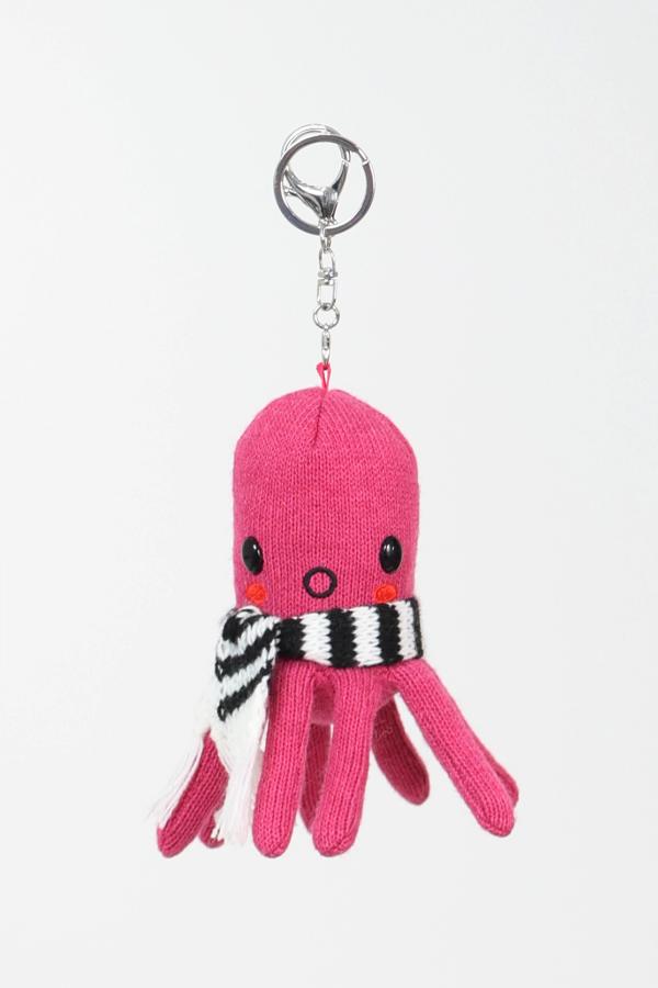 Magenta octopus plushie keychain wearing a scarf. Comes with detachable key ring and key clip for accessorizing.