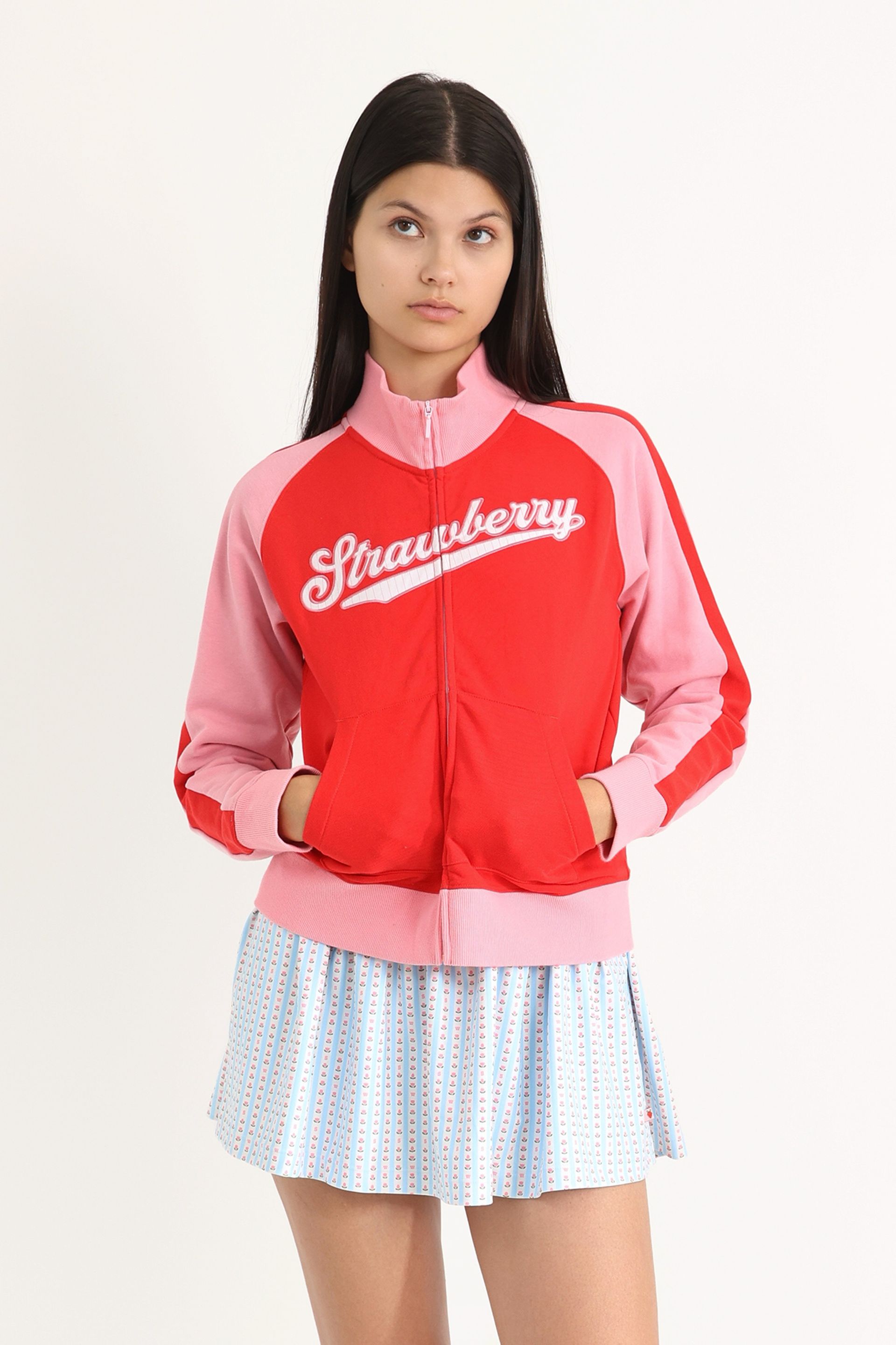 Gathered skirt exercise dress featuring an attached interior unitard with side pockets. Comes in a hand-drawn, Blue/Ivory floral border stripe print with gingham bow details.