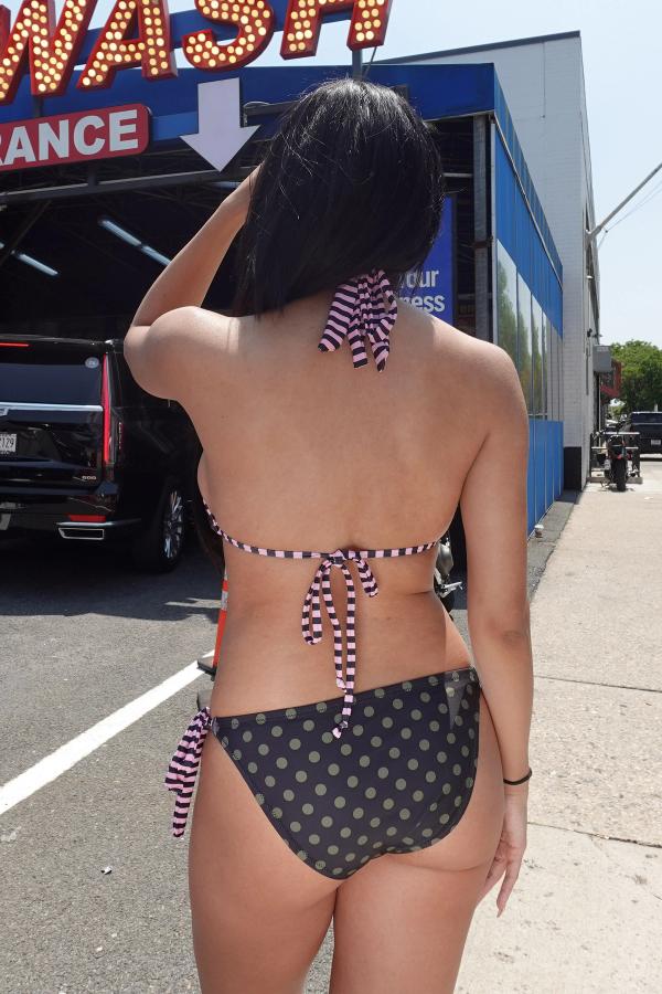 Olive side tie bikini bottom in a mixed pattern combo with a sakura graphic at front.