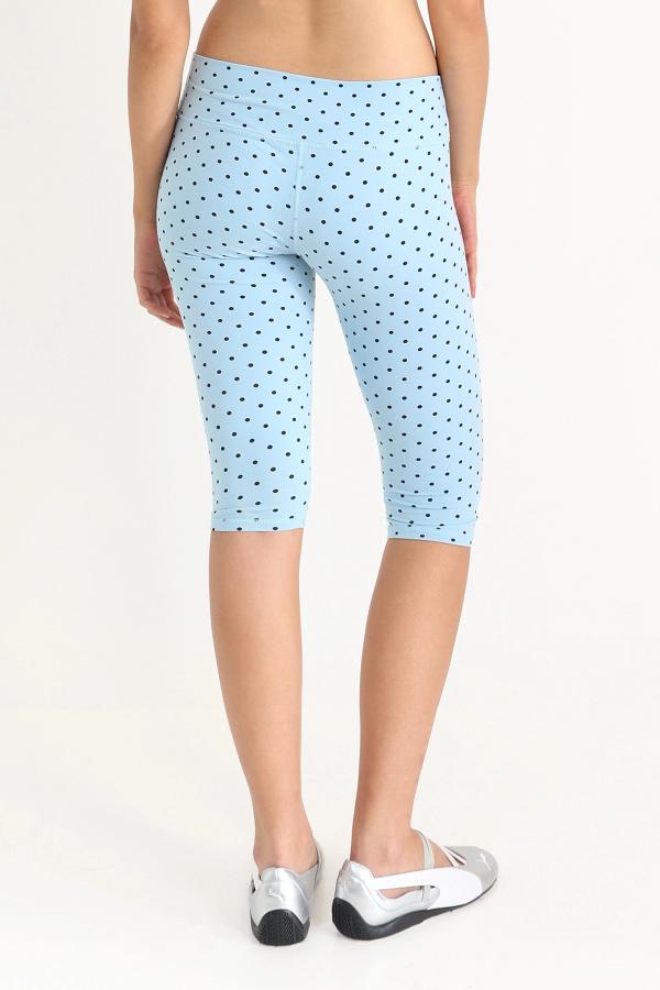 Super flattering, lower-rise capri leggings in a Blue Polka Dot print with gingham bows at the front.