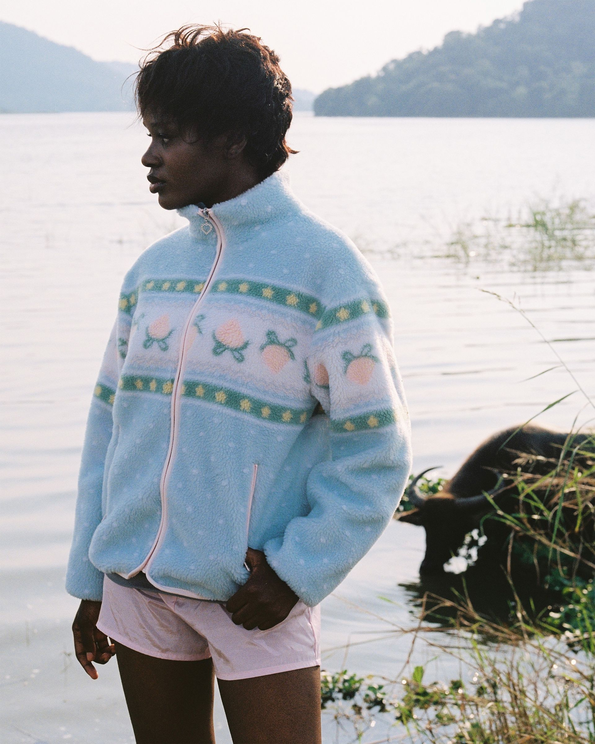 Kawaii baby blue pastel sherpa fleece jacket worn on a hike to a pond in Thailand.