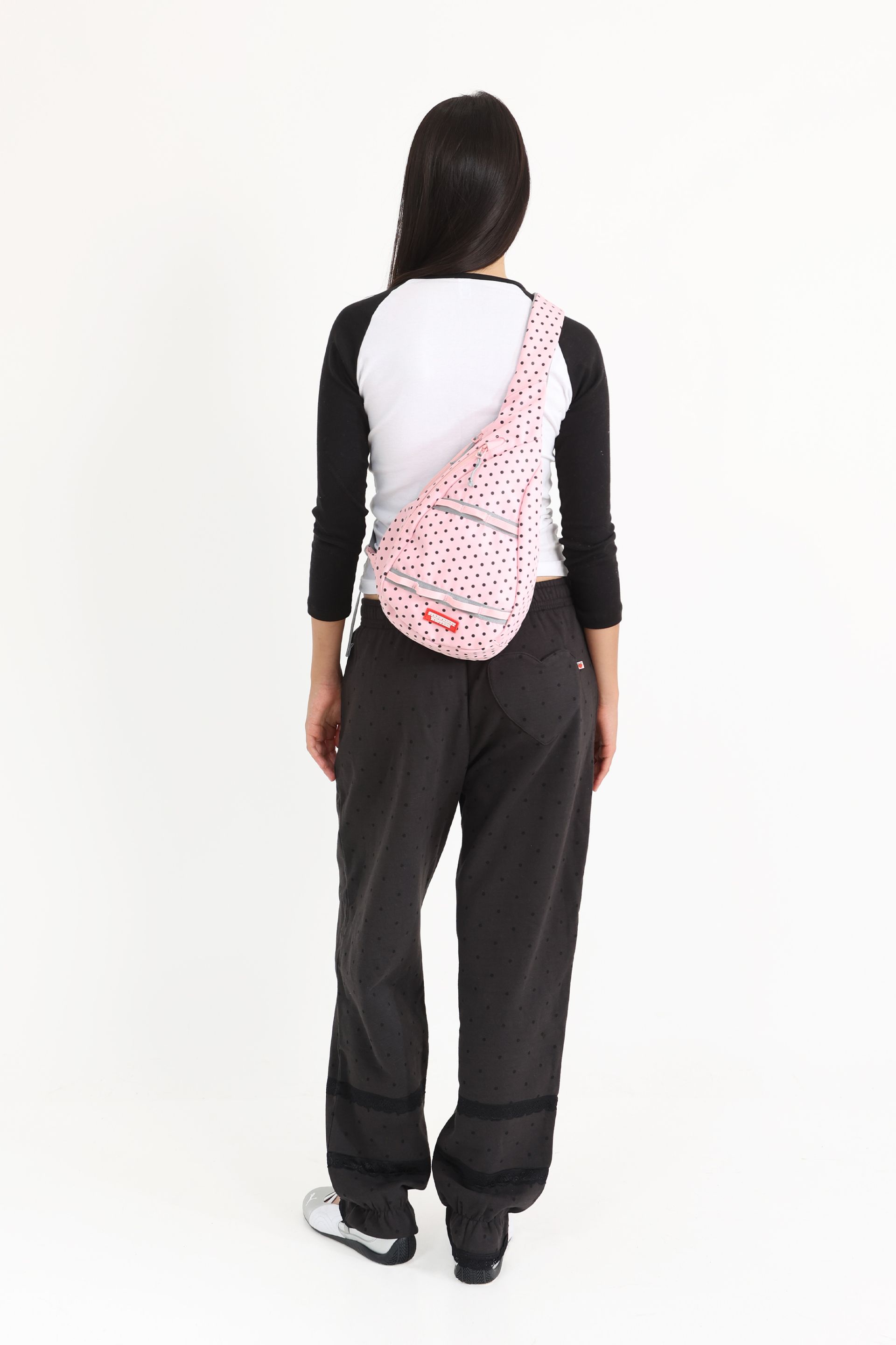 Bloomer-style sweatpants in washed Black with tonal black polka dot print and black lace details at the leg openings.