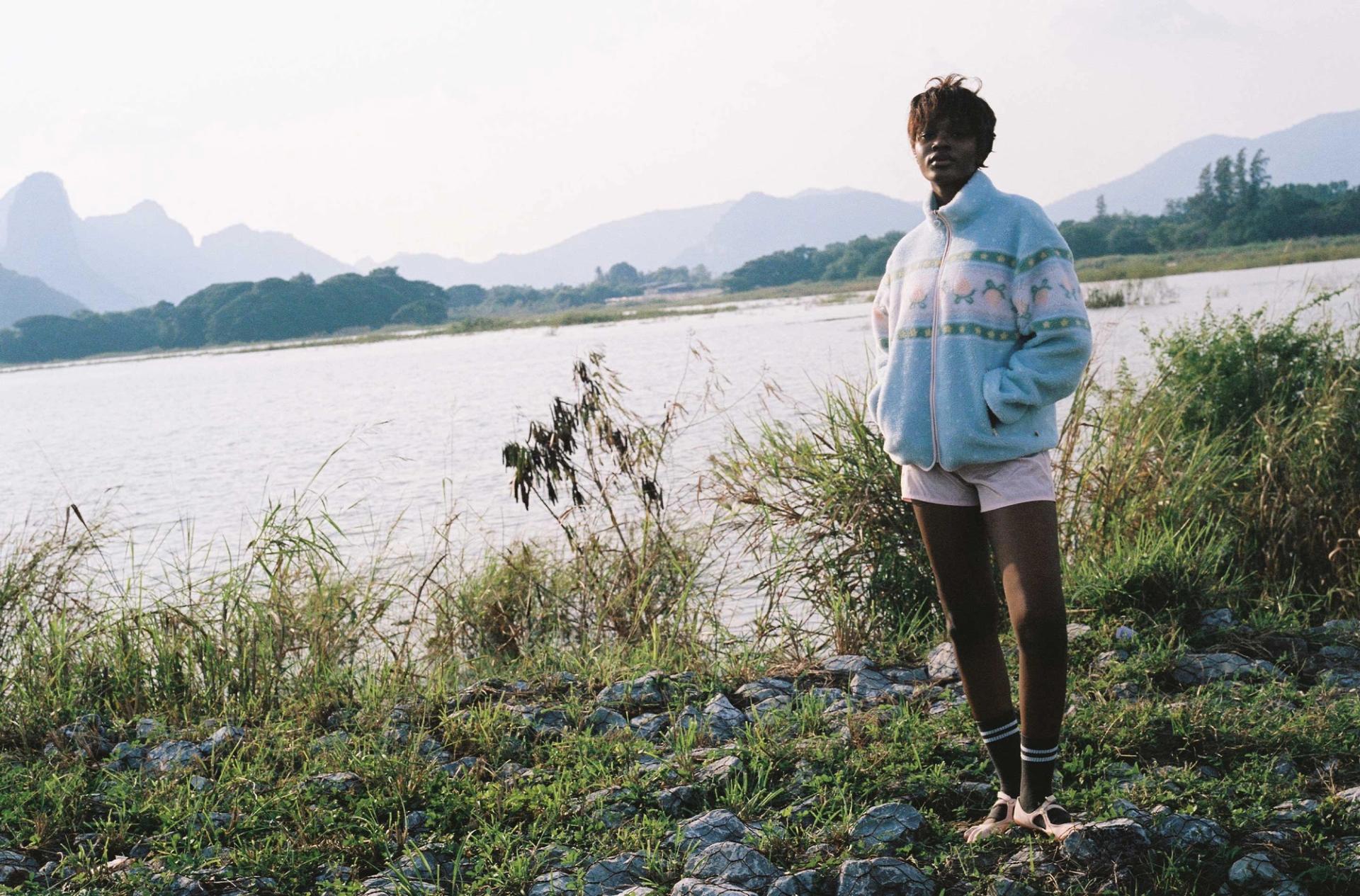 Kawaii baby blue pastel sherpa fleece jacket worn on a hike to a pond in Thailand.