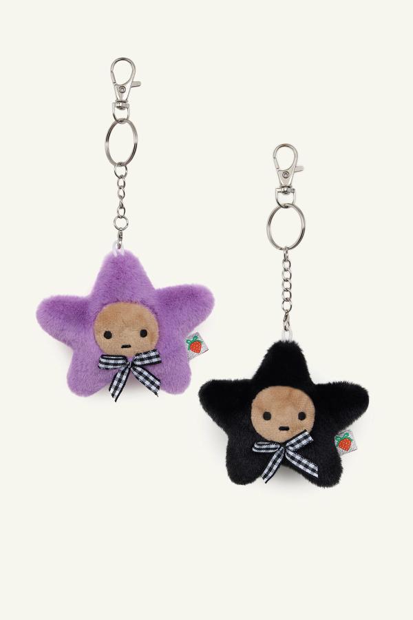 Black Purple Kissing Starbaby star-shaped keychain set each with a small face, checkered bow, and metal clasp.