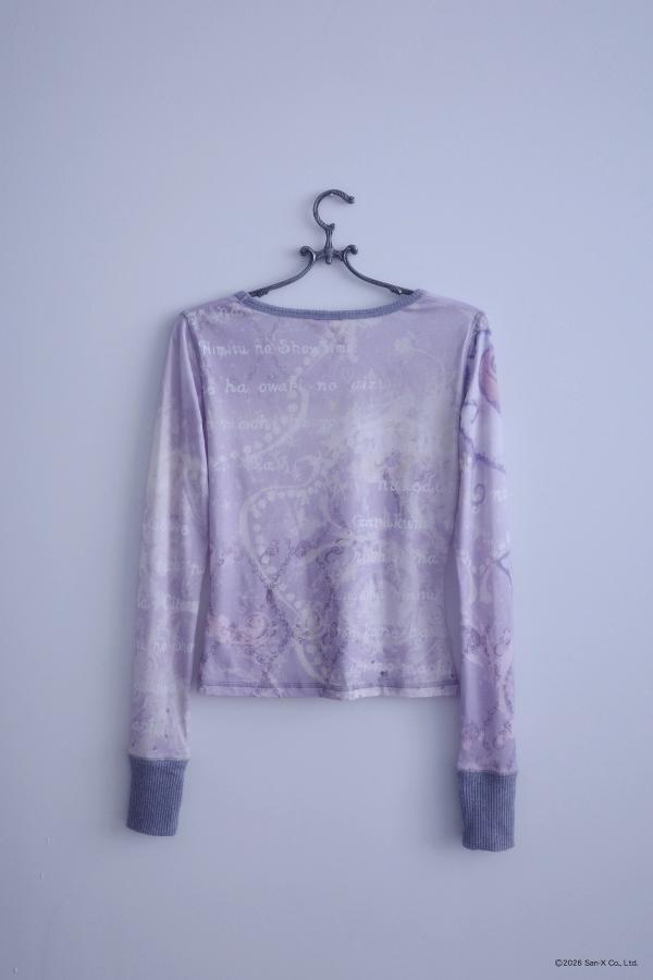 Flat image of a hanger holding an ethereal engineered print long-sleeve top featuring Shappo the Ringmaster. Cut from a lightweight, 110gsm 100% Cotton with chunky, heathered dusty purple ribbing at the neck and sleeve cuffs. The sleeves are finished with taller cuffs and built-in thumb holes, providing extra coverage and keeping your hands warm during the colder months.