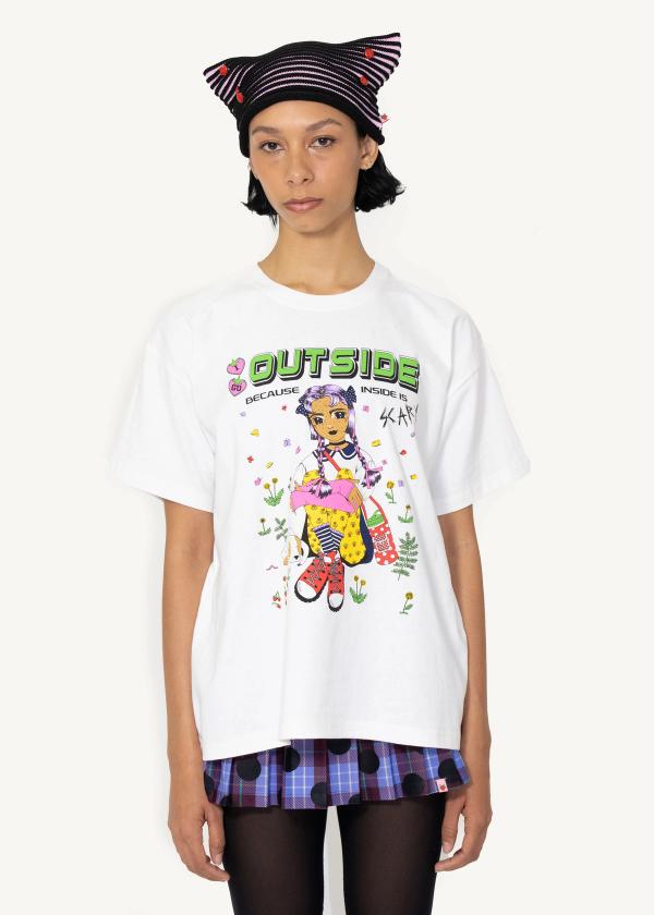 Model wears natural color t-shirt with a vintage anime-style schoolgirl screenprint with text saying 'I GO OUTSIDE BECAUSE INSIDE IS SCARY'.
