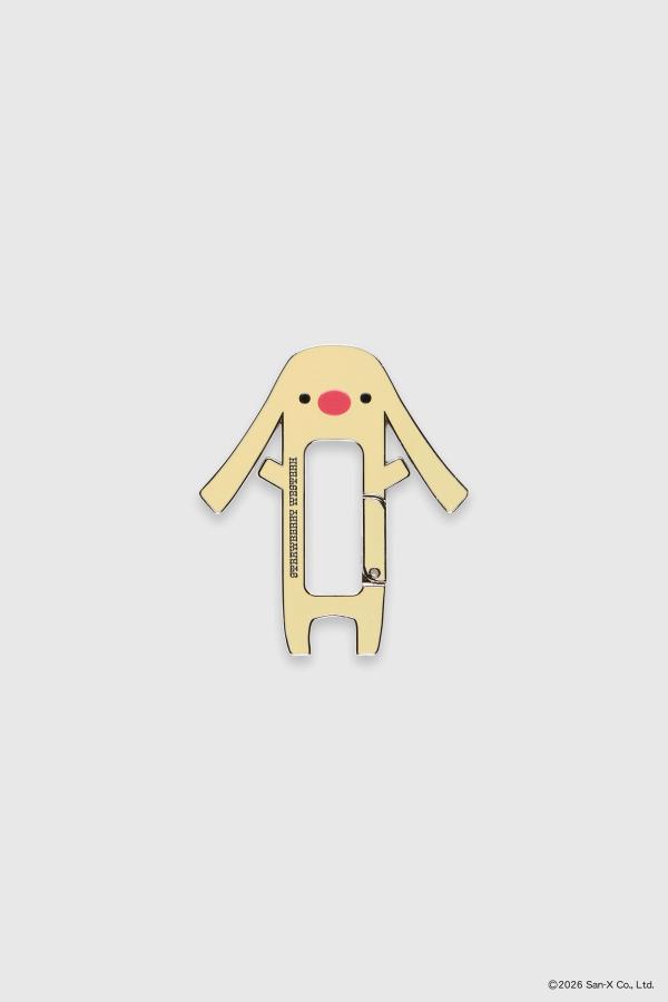Flat image of Toto carabiner, shaped like a dog/bunny hybrid with long, floppy ears and a big red nose. The skin color is yellow with two black dots for eyes. Strawberry Western logo on the front.