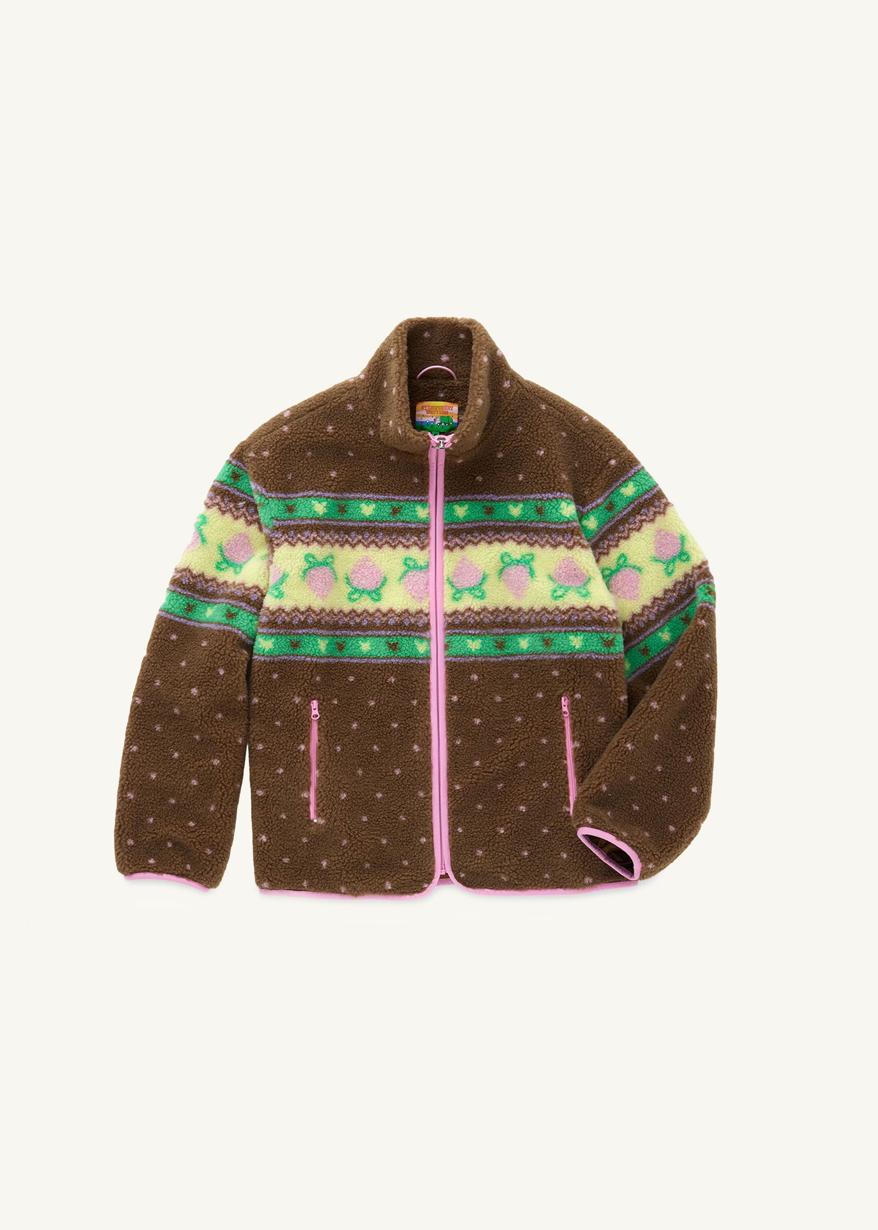 Flat front view of a brown fluffy jacquard knit sherpa jacket in a choco strawberry border motif with pink binding, pink zippers and a metal heart shape zipper pull..