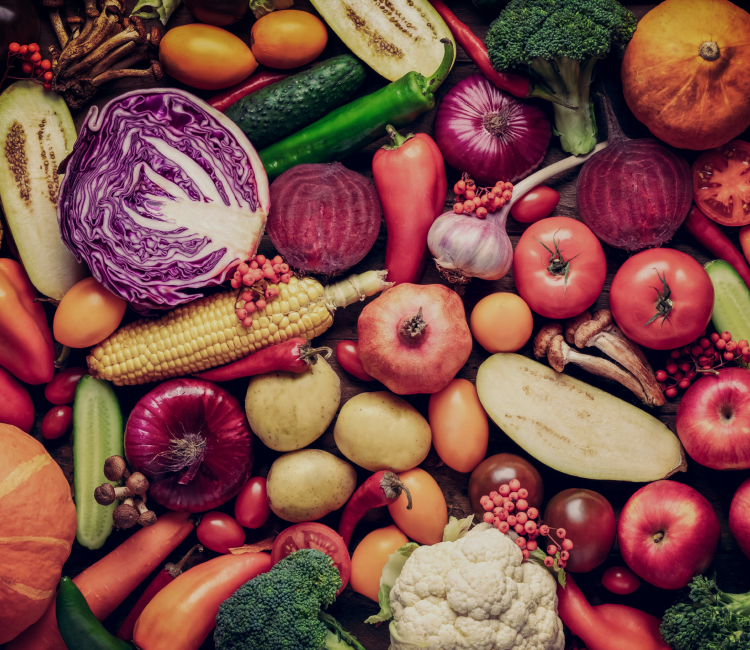 A variety of fresh fruits and vegetables displayed in a colorful arrangement.