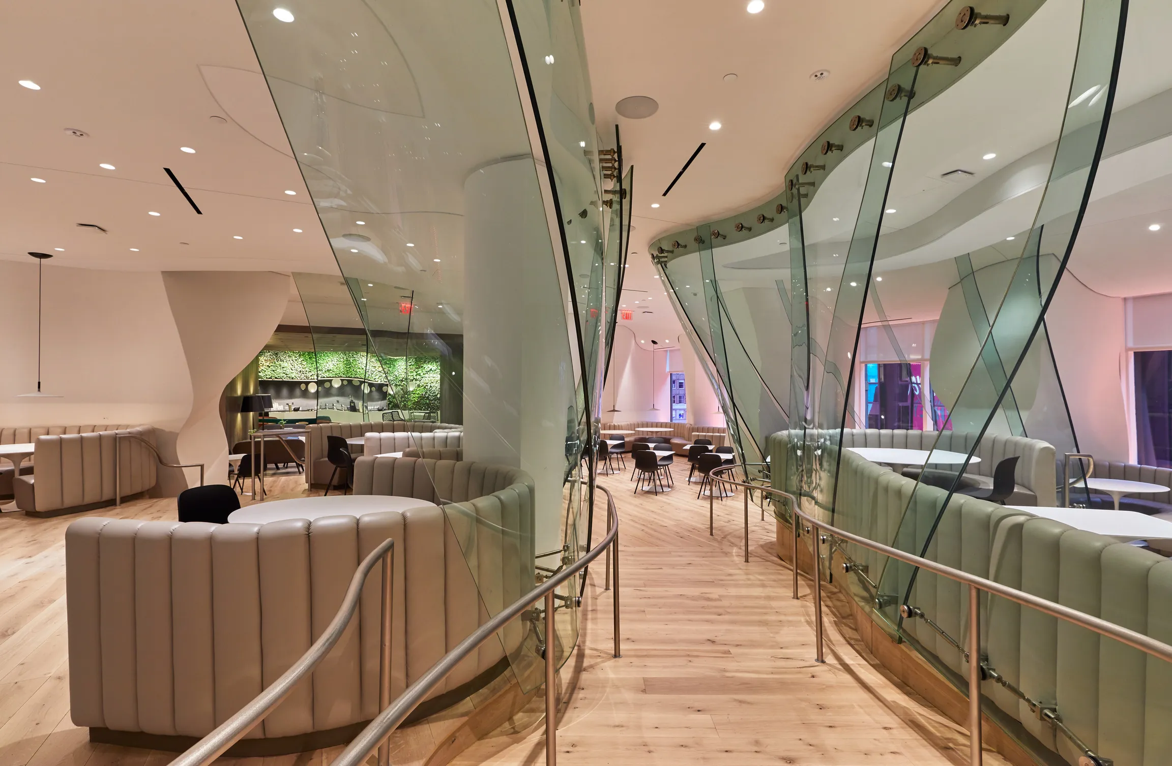A contemporary cafe with glass walls and a bar. With bright illumination coming from natural light.