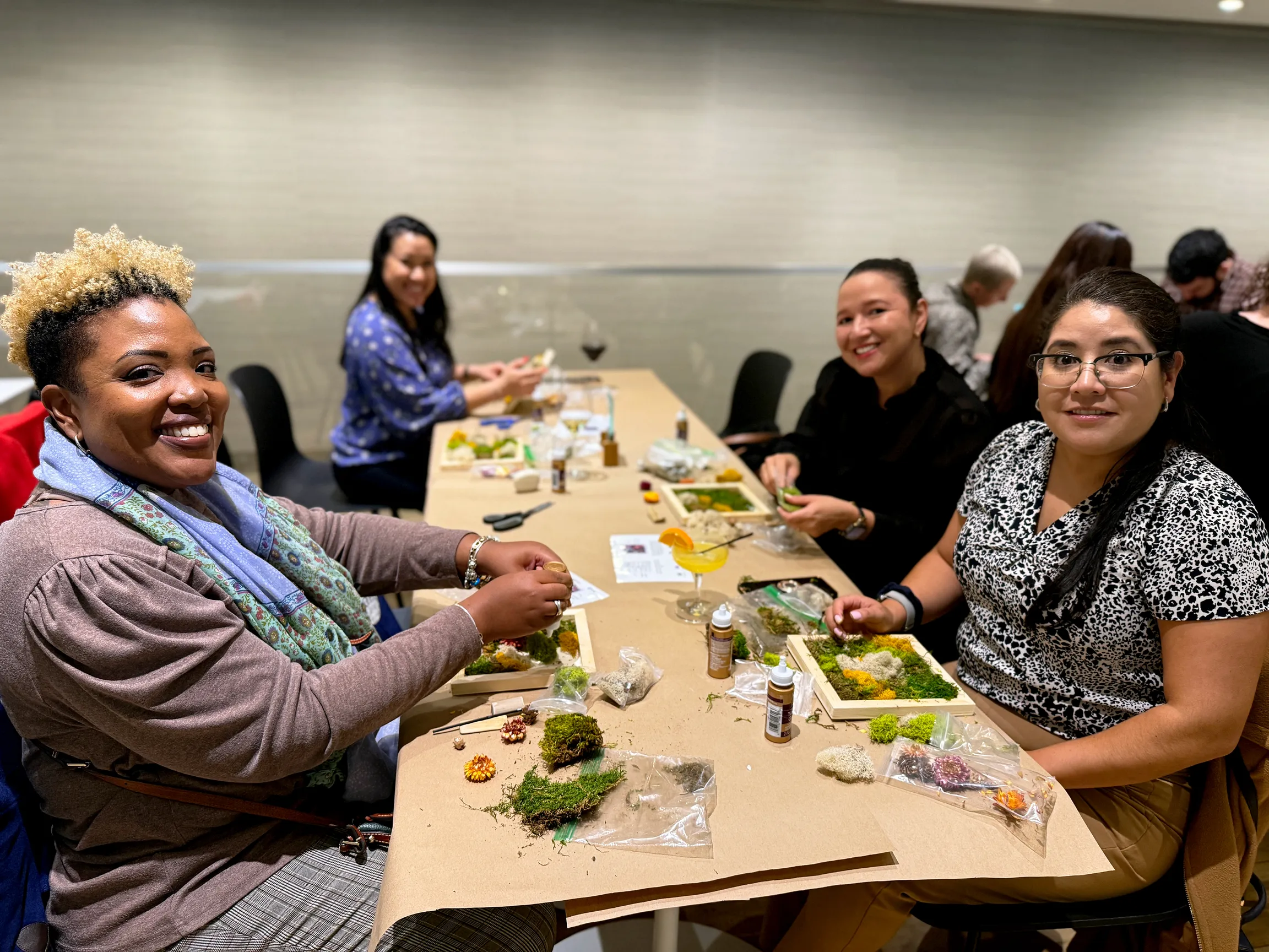 Tenants at One Five One participating in moss wall workshop