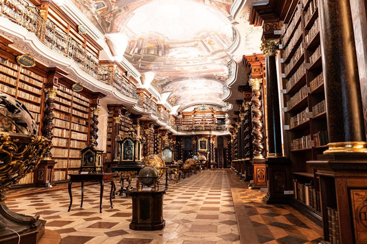 Interiors of the Clementinum Library with books and installations