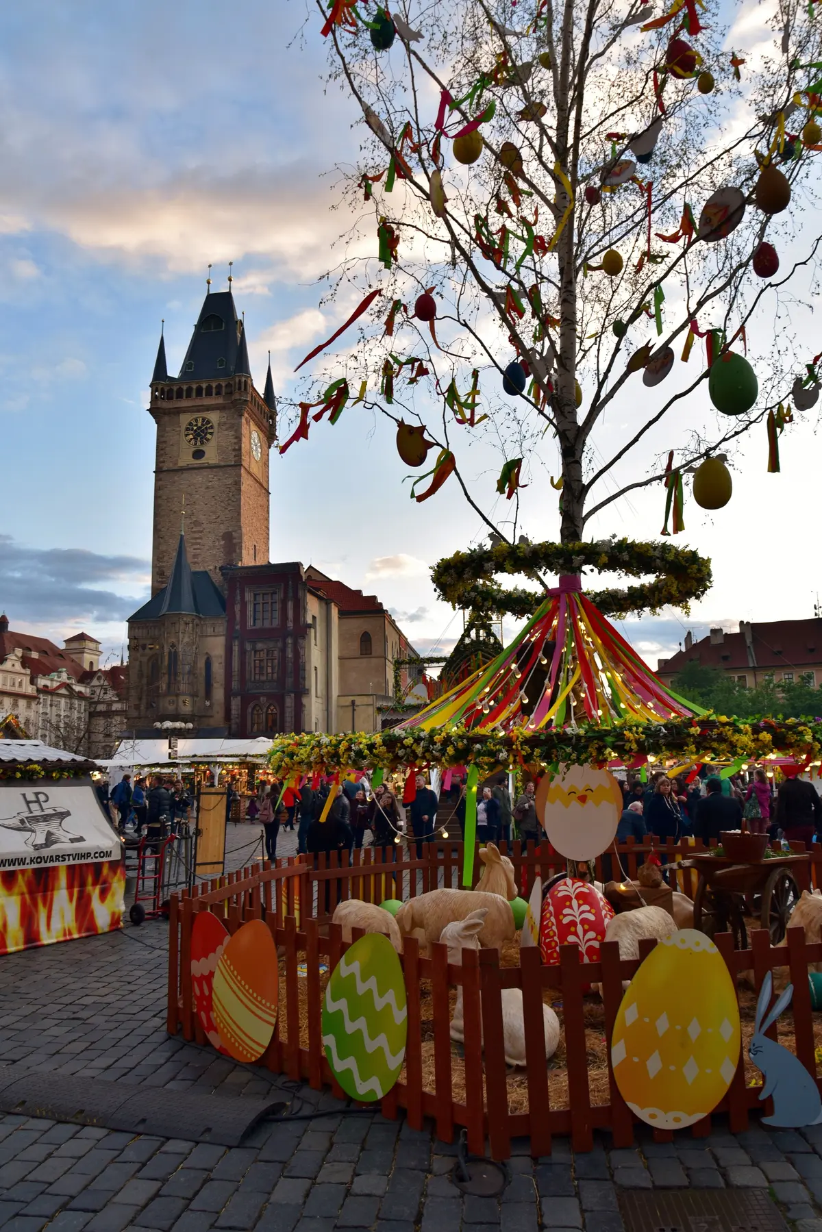 An Easter tree decorated with eggs at the Old Town Square market, in front of the Town Hall tower