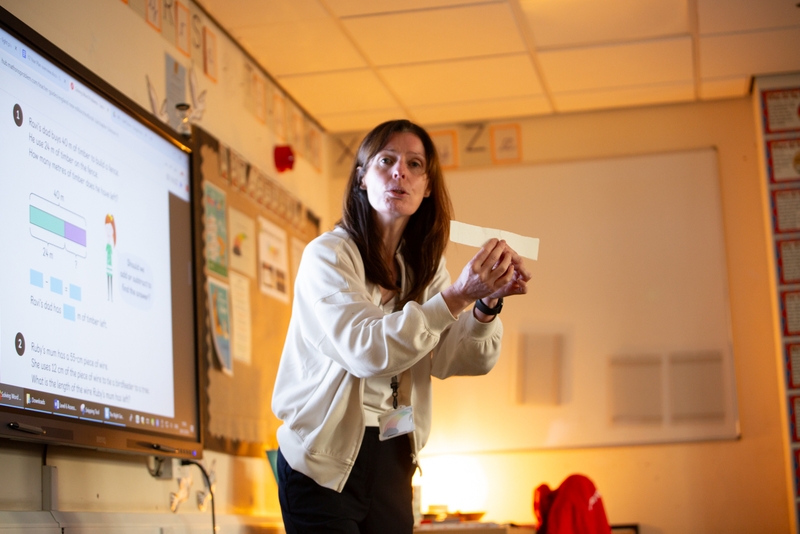 Teacher speaking to class.