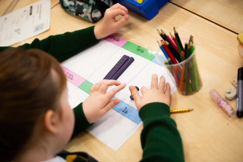 Girl working with manipulatives