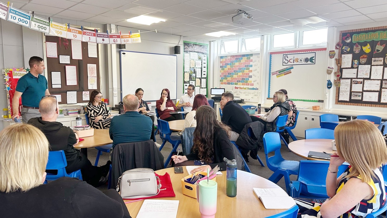 A group of educators participating in a professional development session