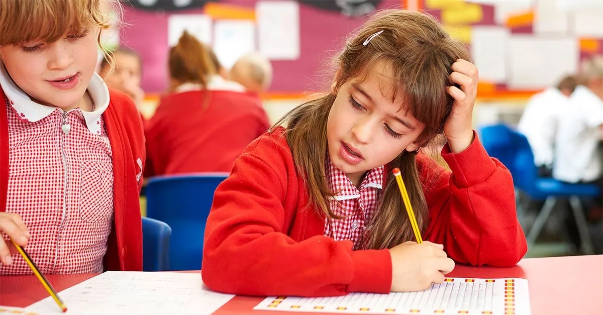Pupil from Wray Common Primary School work on mathematics worksheet