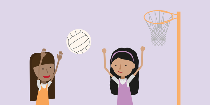 Two maths students playing a game of netball. The girl on the left is taking a show while the girl on the right is defending.