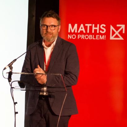 Adam Gifford speaking at the Maths — No Problem! Annual Conference